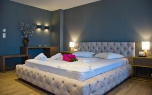 Un pat sau paturi într-o cameră la Hotel Viky