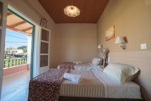 Postel nebo postele na pokoji v ubytování ASPASIA APARTMENTS