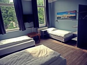 Postel nebo postele na pokoji v ubytování Apart Hotel Sarstedter Hof