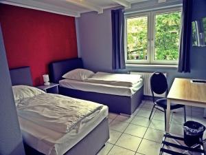 Postel nebo postele na pokoji v ubytování Apart Hotel Sarstedter Hof