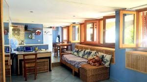 a living room with a couch with a stuffed animal on it at Villa Calamona in Acciaroli