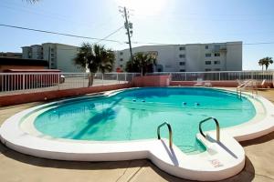 a large swimming pool in the middle of a building at Tropical Isle #205 in Fort Walton Beach