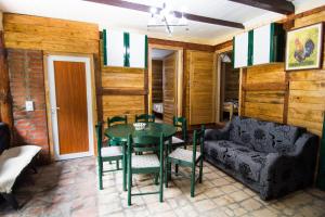 a living room with a table and a couch at Vajat Tuk in Bajina Bašta +35 photos