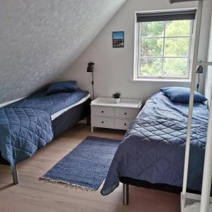 En eller flere senge i et værelse på Samsø værelseudlejning