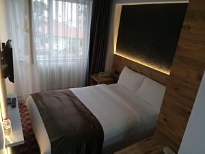 Postel nebo postele na pokoji v ubytování ESKOPPremium OTEL