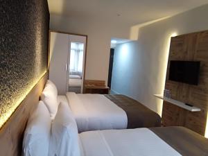 Postel nebo postele na pokoji v ubytování ESKOPPremium OTEL