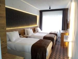 Postel nebo postele na pokoji v ubytování ESKOPPremium OTEL + 37 fotografií