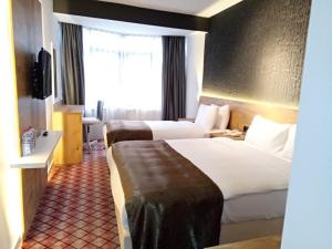 Postel nebo postele na pokoji v ubytování ESKOPPremium OTEL