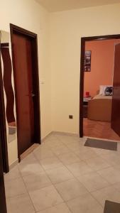 a room with a door and a bedroom with a bed at Apartments Nena in Split