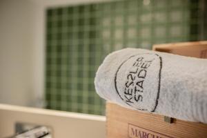 a towel on top of a box in a bathroom at Kesslerstadel in Matrei in Osttirol