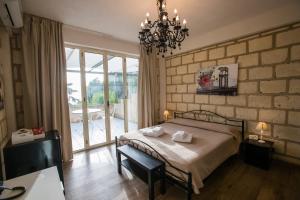 Postel nebo postele na pokoji v ubytování CapoSperone Resort