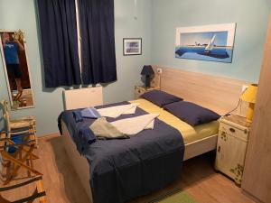 a bedroom with two beds and a window at Apartments Vila Vino in Sveta Nedelja