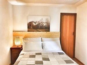 A bed or beds in a room at B&B Il Pettirosso