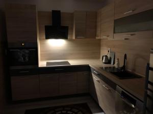 A kitchen or kitchenette at Apartmánový dom Magda