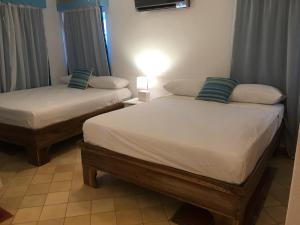 Voodi või voodid majutusasutuse Hotel - Residencial Madrugada toas