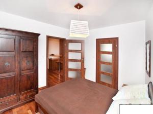 Posteľ alebo postele v izbe v ubytovaní Apartament Haffnera 10