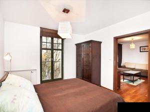 Posteľ alebo postele v izbe v ubytovaní Apartament Haffnera 10