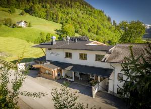 an aerial view of a house in the mountains at Restaurant Appartements Almdiele in Hart im Zillertal