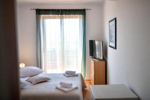 Llit o llits en una habitació de Hotel Levant