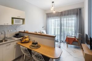 Kuchyň nebo kuchyňský kout v ubytování PLOUMIS seaside villas + 56 fotografií