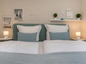 Postel nebo postele na pokoji v ubytování Meerliebe