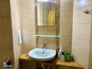 a bathroom with a sink and a mirror at Свети Зосим in Sozopol +63 photos