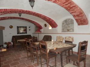a dining room with a table and chairs at Zámeček Zdíky - Zámecký apartmán in Bujanov