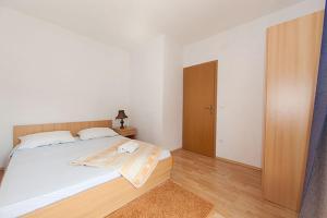 Posteľ alebo postele v izbe v ubytovaní Apartments IVO
