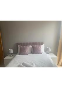 A bed or beds in a room at City Apartments Milton Keynes 