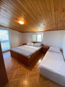 Postel nebo postele na pokoji v ubytování Apartment Meri + 37 fotografií