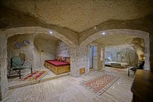 Postel nebo postele na pokoji v ubytování Vigneron Cave Hotel