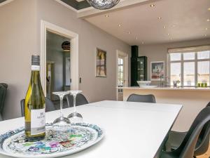 een fles wijn op een bord op een tafel bij 12 person holiday home in Nyborg in Nyborg