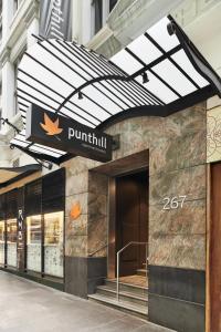 a building with a sign on the side of it at Punthill Apartment Hotel - Flinders Lane in Melbourne