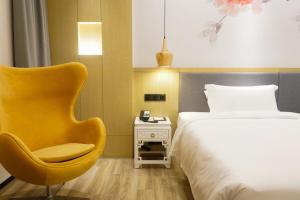 Paco Hotel BeiJing Road Metro Guangzhou-Free Shuttle Bus For Canton Fair客房内的一张或多张床位