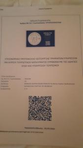 a piece of paper with writing on a wall at Villa Giorgos in Kefalos
