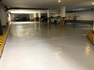 a flooded parking lot with cars in a parking garage at Hotel Casa Blanca Internacional in Mexico City