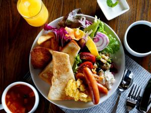 a plate of breakfast food with toast and a salad at Green Rich Hotel Yonago Ekimae (Artificial hot spring Futamata Yunohana) in Yonago