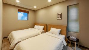 Interlaken Stay客房内的一张或多张床位
