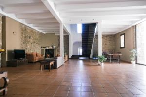 a large living room with a couch and a table at La Albacara in Moya