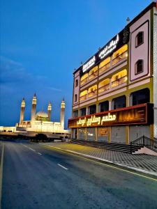 a building with a street in front of it at Aryaf Nizwa Hotel Apartments in Nizwa