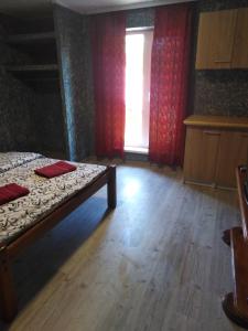 Postel nebo postele na pokoji v ubytování Гостевая комната
