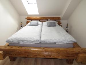 Postel nebo postele na pokoji v ubytování Apartman Honey