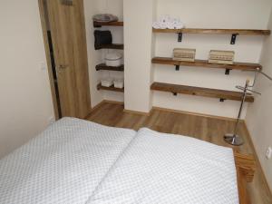 Postel nebo postele na pokoji v ubytování Apartman Honey