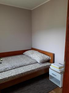 A bed or beds in a room at Apartmani Maksimović