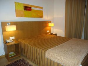 Cama ou camas em um quarto em Hotel Jose Alberto
