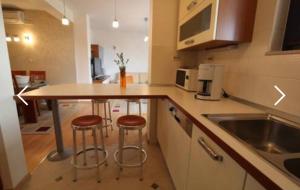 Kuchyňa alebo kuchynka v ubytovaní Apartman San Marino 2