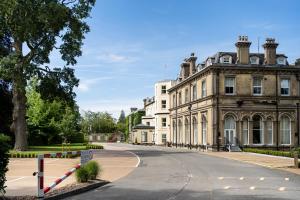 an empty street in front of a large building at The Spa Hotel in Royal Tunbridge Wells