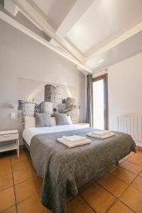 Łóżko lub łóżka w pokoju w obiekcie La Albacara