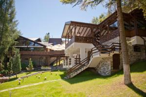 a building with stairs on the side of it at Cabana Schiori in Sinaia