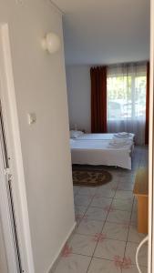 Postel nebo postele na pokoji v ubytování Hotel Camelia
